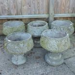 A set of five reconstituted stone garden planters,