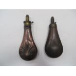 Two 19th Century Powder Flasks consisting copper and brass shell design bag shape flask. The brass