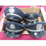 Four Various American Police Caps dark blue crown with lower black band. Black patent peaks. Various