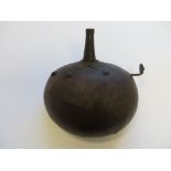 Early 19th Century Indian Powder Flask leather covered steel disk body with plain steel nozzle. Side