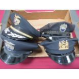 Four Various American Police Caps consisting two blue examples with black patent peaks. Gilt New