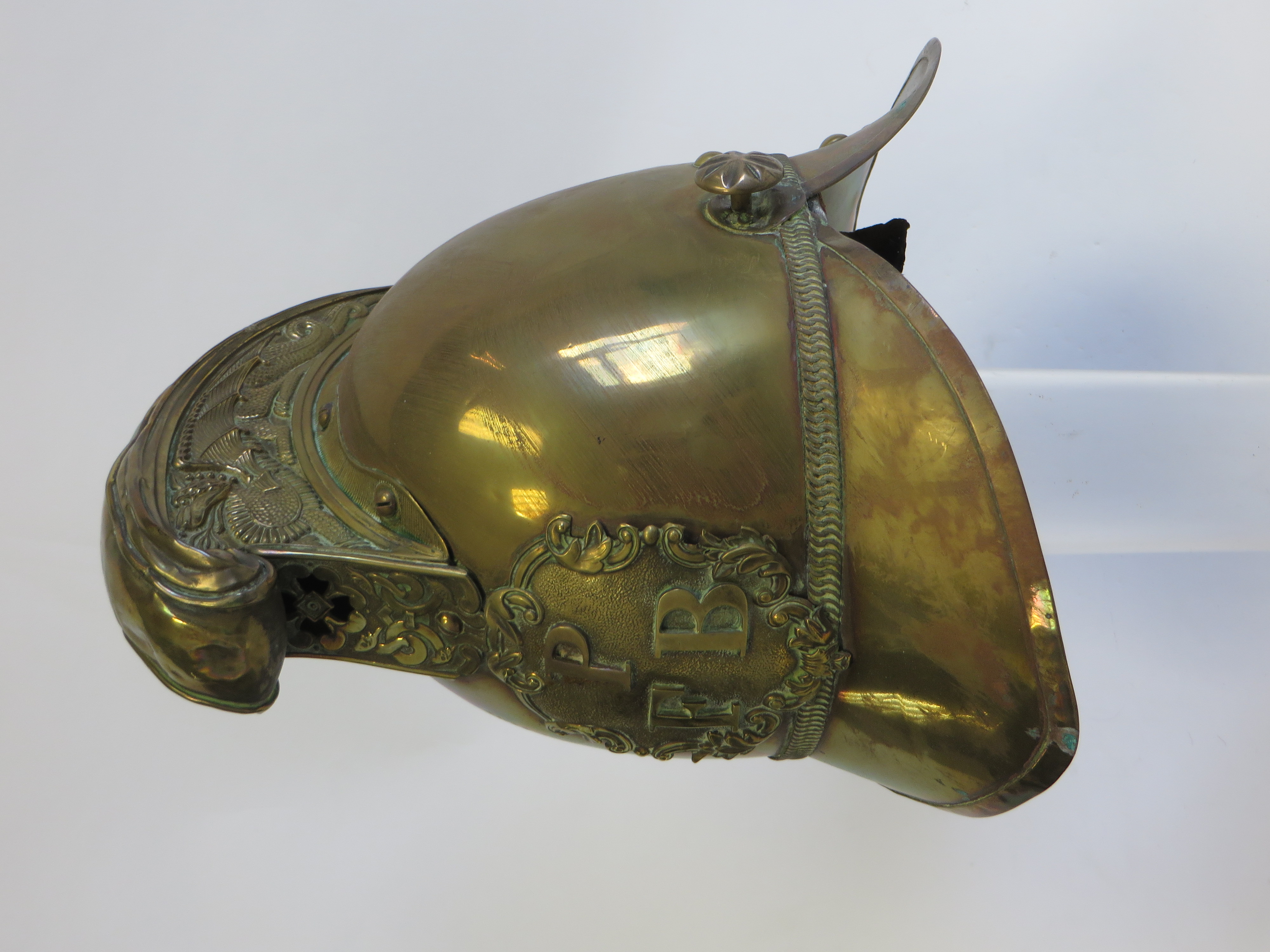 Late 19th Century Brass Fire Brigade Helmet brass high crown, pointed peak and swept rear brim. High