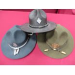 Three Various American Police Stetson Hats consisting blue felt example with silvered cap cords.
