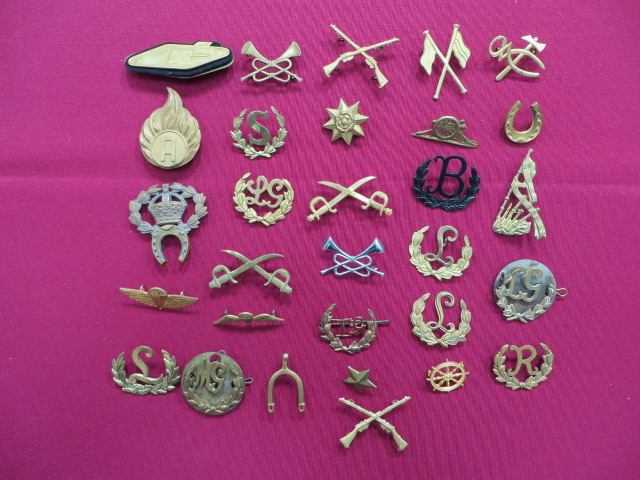 Selection of Brass Trade Proficiency Badges including LG within a wreath ... L within a wreath ... R