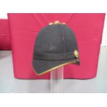 Officer’s Home Service Helmet black melton cloth covered four panel high crown. Pointed front peak