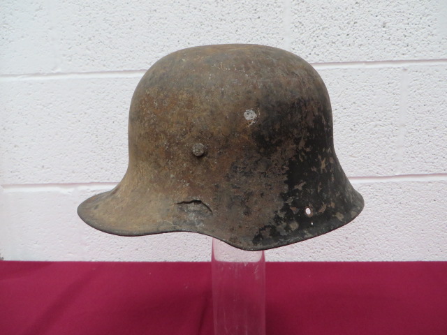 WW1 Imperial German Helmet Battle Damaged Shell steel crown of typical form with lower rolled