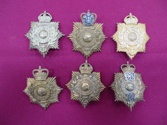 Small Selection of Royal Marines Helmet Plates consisting QC brass and silvered Plymouth Band ... QC