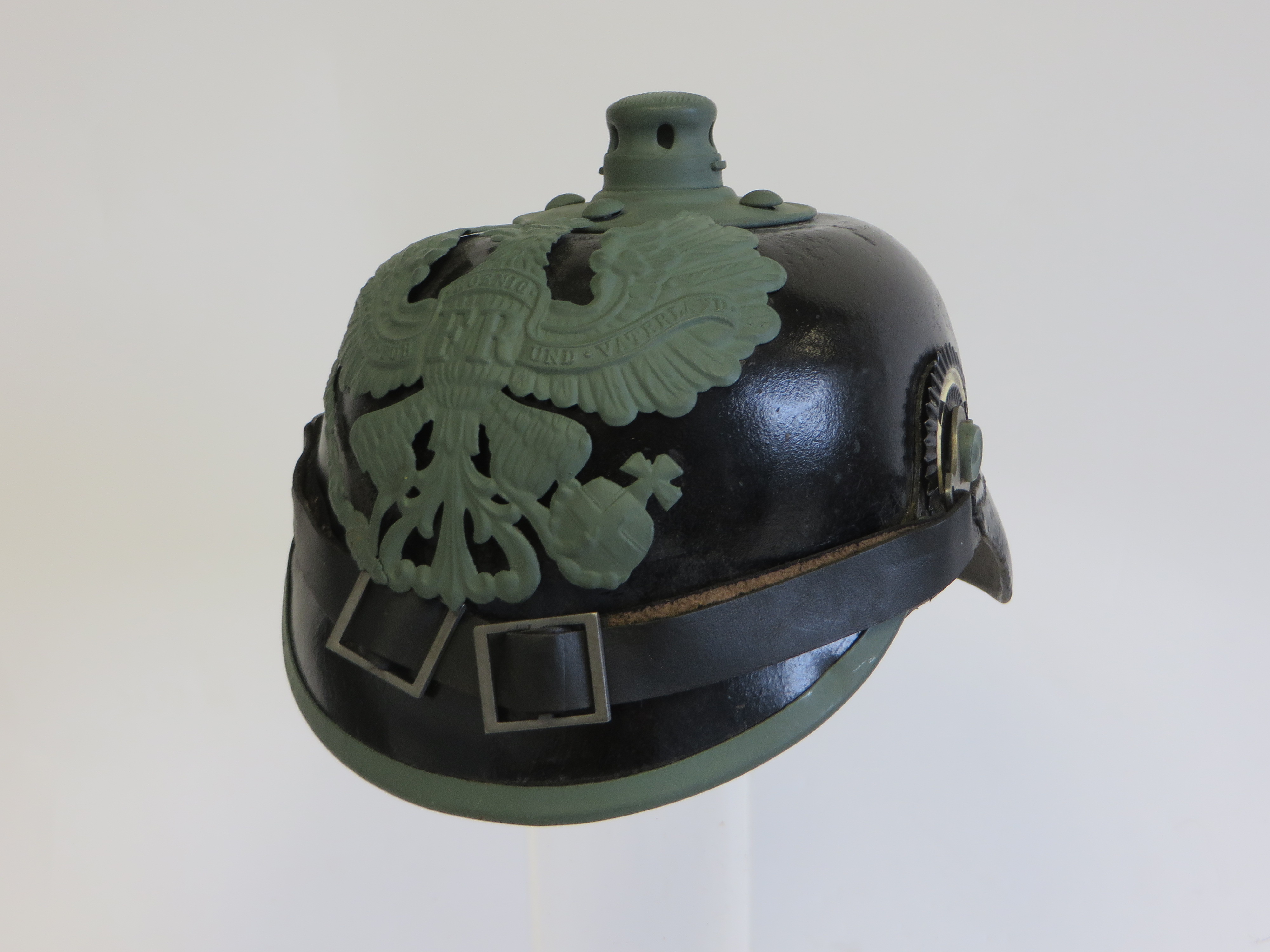 WW1 Imperial Prussian Pickelhaube black leather crown. Front peak with steel edging. Plain rear