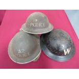 Three WW2 British Steel Helmets consisting black painted example with stencilled white “W” to the