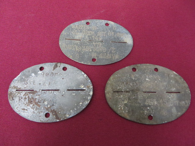 Three German ID Tags Including SS consisting alloy one piece splittable ID tag stamped Waffen SS.