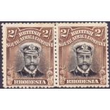 RHODESIA STAMPS: 1913  2/- Black and Brown. Lightly mounted mint horizontal pair. Die 1 perf 14.