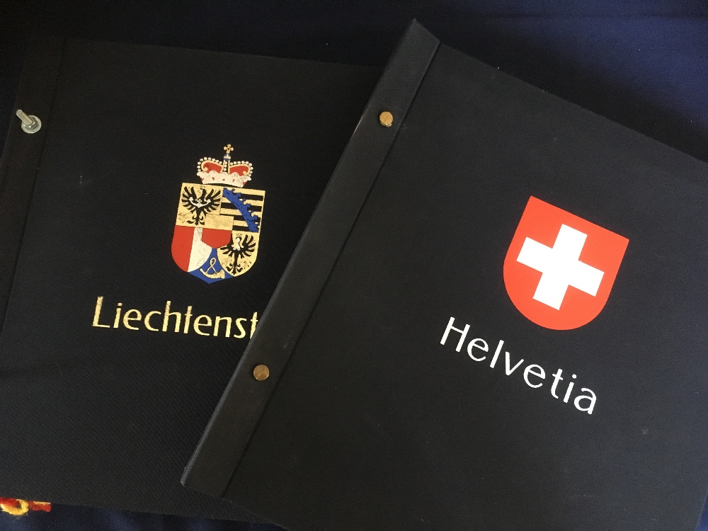 Switzerland and Liechtenstein Davo stamp albums, sparcely filled mint and used