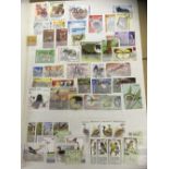 STAMPS : World ex-dealers selection in stockbook mostly U/M inc animals, ships, birds, aircraft etc.