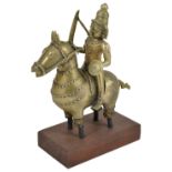 KHANDOBA SEATED ON HIS HORSE, WESTERN DECCAN, INDIA, CIRCA 18TH CENTURY cast brass, holding sword