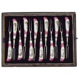A SET OF TWELVE FRUIT KNIVES AND TWELVE FORKS, THE PORCELAIN HANDLES GERMAN OR FRENCH, LATE 19TH