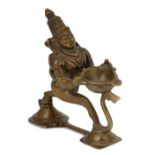 A PUJA LAMP, SOUTH INDIA, 19TH/20TH CENTURY in the form of Hanuman, with scrolling tail, his lamp
