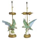 A PAIR OF PORCELAIN PARROT FIGURES, FRENCH OR GERMAN, LATE 19TH CENTURY, LATER MOUNTED AS ELECTRIC