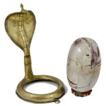 A LARGE LINGAM STONE AND ASSOCIATED BRASS COBRA STAND, INDIA, 18TH CENTURY AND LATER the former of