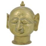 A BRASS GAURI HEAD, GUJARAT, WESTERN INDIA, 19TH CENTURY with pronounced stylised features, with