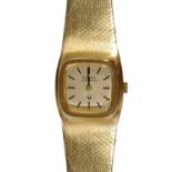 BULOVA ACCUTRON: A LADY'S EIGHTEEN CARAT GOLD BRACELET WATCH, 1974 the square textured gold dial