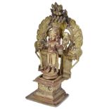 A BRASS FIGURE OF DURGA, WESTERN DECCAN, INDIA, 18TH CENTURY in three sections, standing on a raised