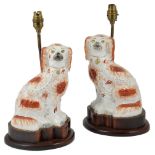 A PAIR OF STAFFORSHIRE SPANIEL FIGURES, SECOND HALF 19TH CENTURY, LATER MOUNTED AS ELECTRIC LAMPS