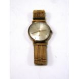 RODANIA: A GENTLEMAN'S NINE CARAT GOLD WRISTWATCH, 1964 silvered dial with gold batons and