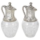 A PAIR OF SILVER-MOUNTED CLARET JUGS, 20TH CENTURY cut-glass bulbous bodies, the silver neck