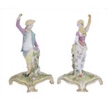 A PAIR OF CHELSEA FIGURES OF A GARDENER AND COMPANION, CIRCA 1760 each standing with one arm raised,