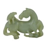 A CHINESE JADE HORSE GROUP, LATE 19TH/EARLY 20TH CENTURY the horse depicted looking back, with two