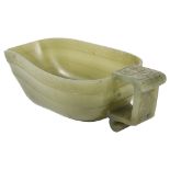 A CHINESE JADE LIBATION CUP, 19TH CENTURY of boat-like form, the rim with key border above a concave