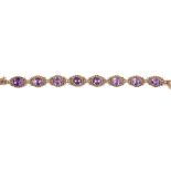 AMETHYST BRACELET designed as a series of eight oval amethysts within twisted rope borders, length