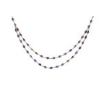 EIGHTEEN CARAT GOLD AND SAPPHIRE NECKLACE designed as a double row of oval sapphires in open