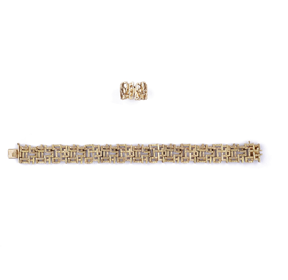 NINE CARAT GOLD BRACELET, CIRCA 1972 designed as a ribbon of textured and raised cubic links,
