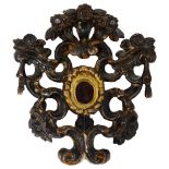 AN ITALIAN CARVED GILTWOOD RELIQUARY FRAME, 18TH CENTURY with openwork scrolls and flowerheads,
