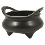 A CHINESE ARCHAISTIC BRONZE CENSER, XUANDE MARK BUT LATER dark patinated, of circular cauldron