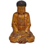 A CHINESE LACQUERED WOOD FIGURE OF BUDDHA, QING DYNASTY wearing voluminous robes, a svastika