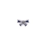 SAPPHIRE AND DIAMOND BROOCH designed as a bow with calibré-cut sapphires and single-cut diamonds