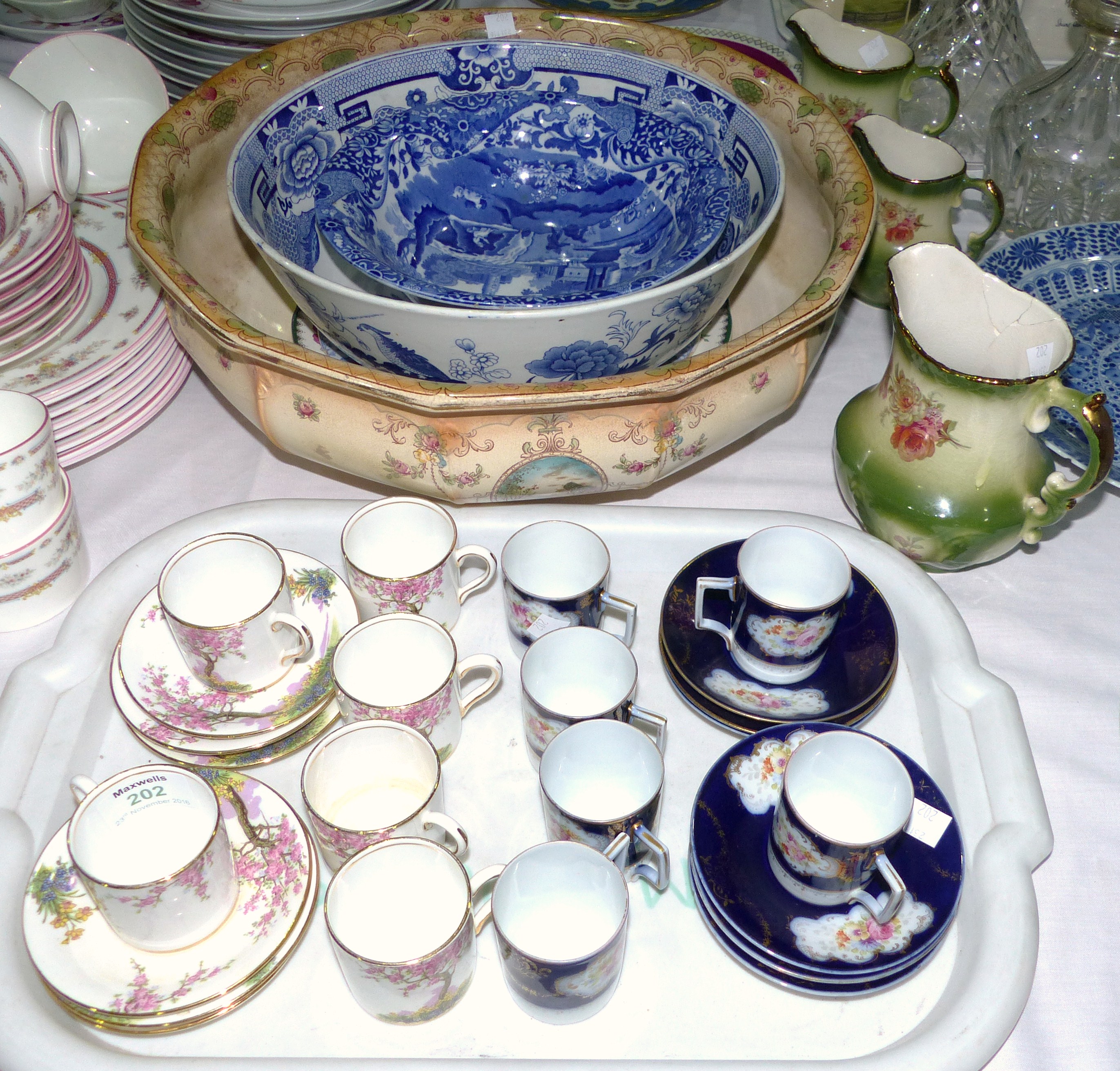 A set of 6 coffee cups and saucers "Springtime; 6 blue and gilt coffee cups and saucers; 2 large