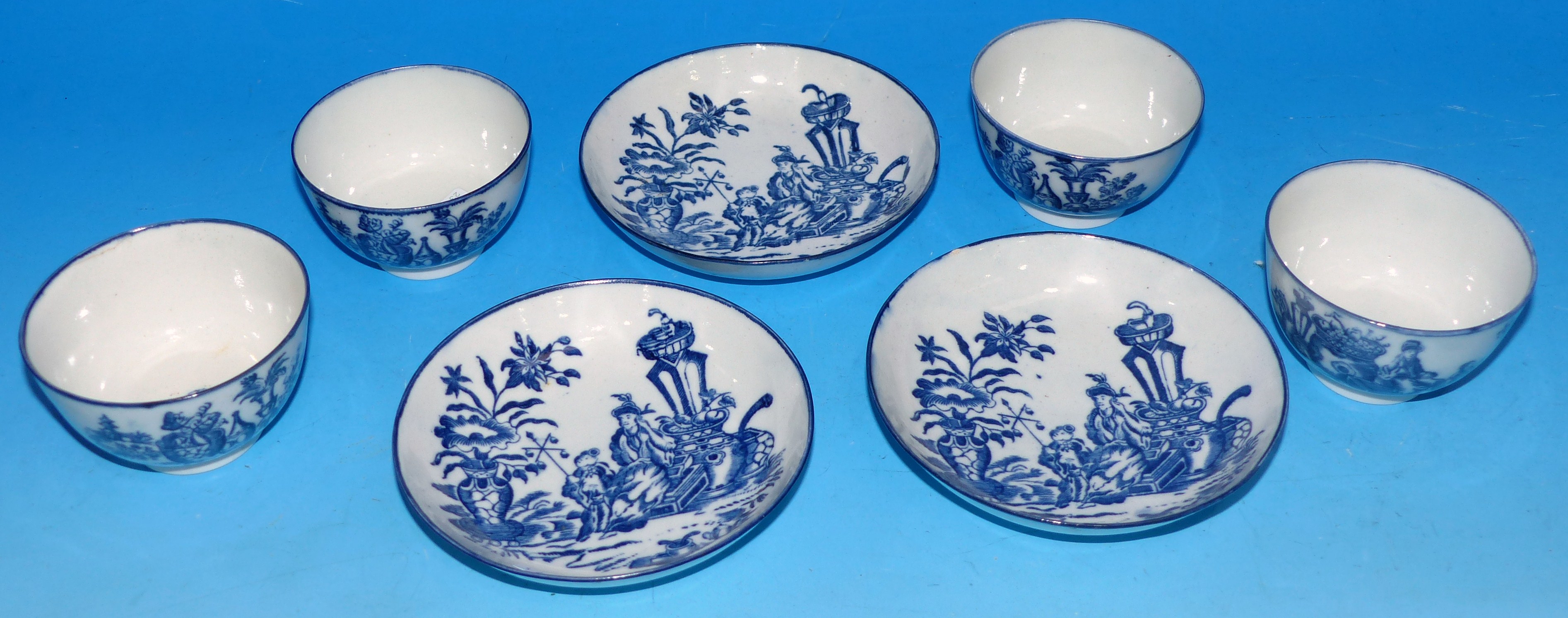 A set of 4 late 18th century English porcelain tea bowls and 3 saucers with blue transfer printed