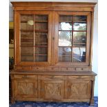 A Continental Cherrywood Three Door Bookcase