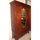 An Edward VII mahogany inlaid wardrobe with mirror door over base drawer. 46" wide
