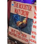 A tin sign decorated with a rooster