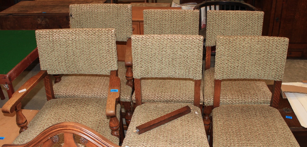 A set of six oak dining chairs, the set to include two carvers