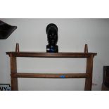 An African carved ebony head with hardwood stand