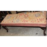 A long stool with tapestry top on cabriole legs. 45" wide