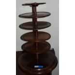 A mahogany six tier dumb waiter