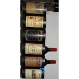 A wine rack with two wine bottle candles