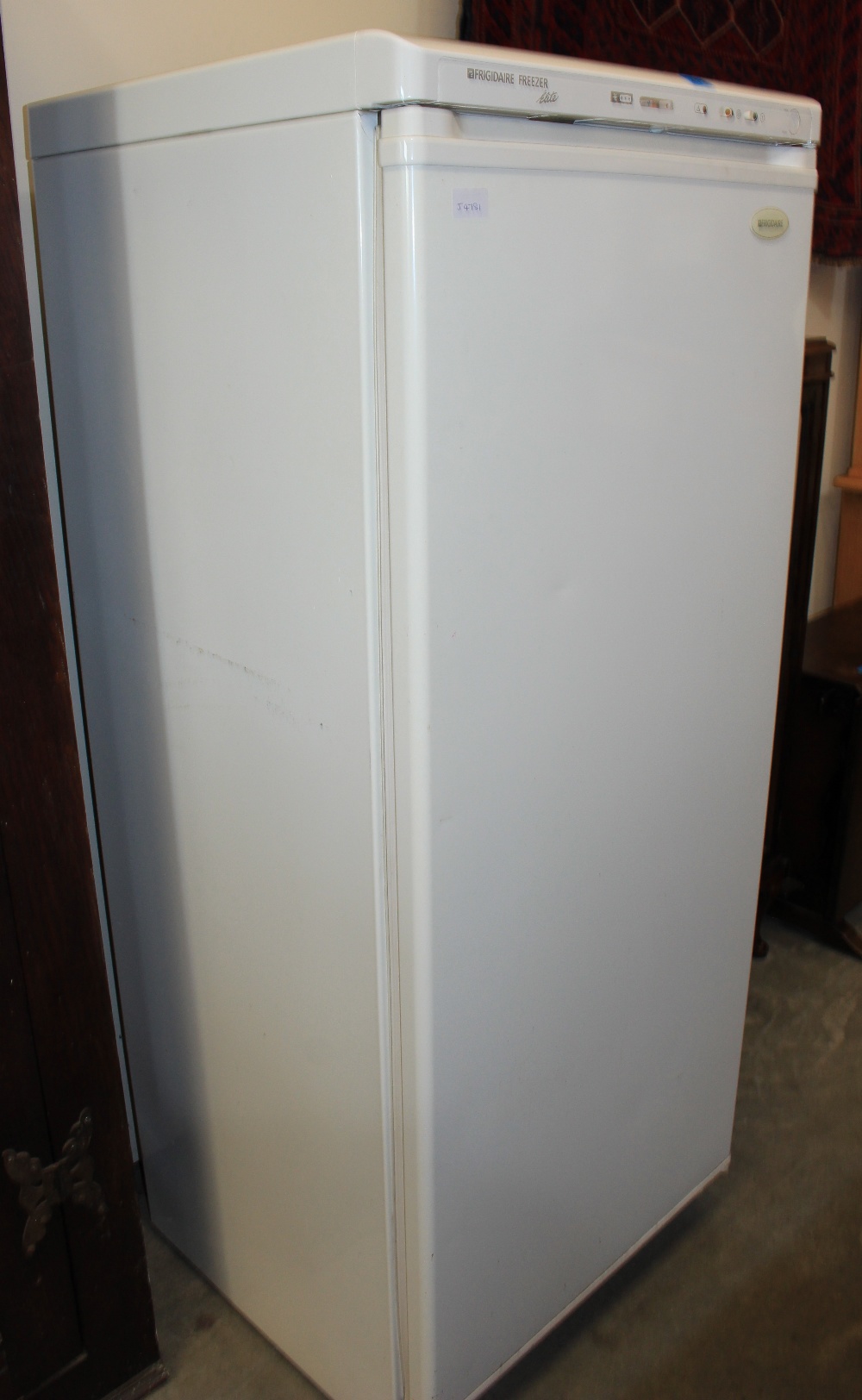 A Fridgidaire freezer finished in white enamel