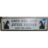 A tin cat sign